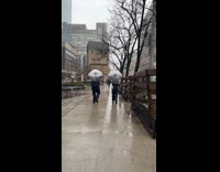 Collab WINY - Two cops wear plastic bag walk in rain