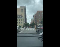 Collab WINY - Person wear onesie brown animal costume cross the street