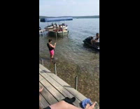 Pink shorts guy girl black jet ski 