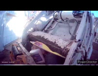 Garbage worker shows garbage disposal 