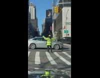 Traffic officer dances in the middle the street 