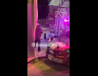 Music video shoot pole dancer behind rapper