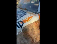 Motorbike tries to ride over a car but does not clear the car 
