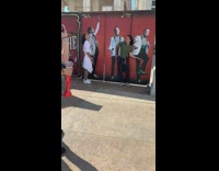 Guy poses with absinthe perfomers