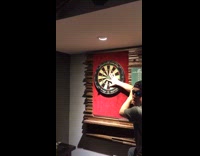 guy nearly misses his finger while playing darts