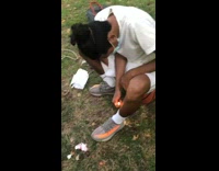 Guy burns leg hair with lighter park