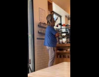 Man with dog on head at shop