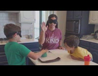 Mother and son plays the egg challenge in the kitchen