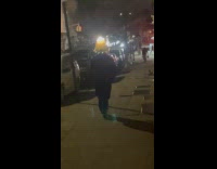 Person wear lampshade hat with light on