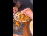 Woman testing boyfriend on restaurant 