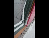 Guy touch snow hang curved on window