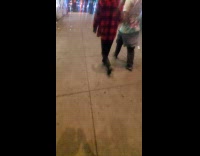 Man black shirt plays drums on street