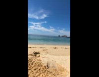 Collab ClipsIG - Womans phone dragged by beach waves