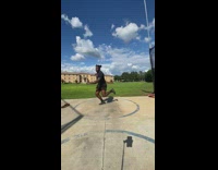 Guy does discus throw in circle 