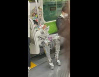 Person in all silver foil material