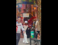 Guy walks around with pigeon on shoulder