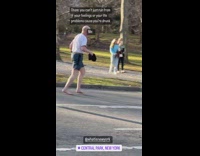 Old Man Jogs Barefoot on Downhill Road