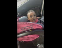 Man Pans Camera on Baby Behind Backseat