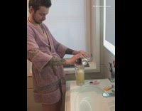 Guy drinks beer in bathtub 