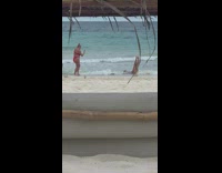 Woman white bikini dance fall beach waves