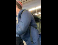 Man in suit raps inside the  train