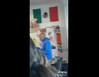 Young kid dances in front of class 