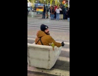 Man on motorized chair crossing street