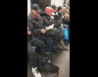 Woman brushes her teeth -and even flosses- on board of the L train during the morning commute