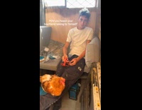 Guy inside of chicken coop talking