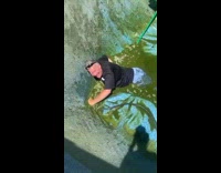 Dad stuck inside of a pool on top of tarp with half his body submerged