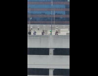 Four men films Power Ranger at rooftop