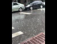Parked car window open in rain