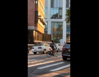 Collab WINY - Man bikes with keyboard piano on head part 1