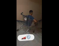 Guy pushes friend downstairs in shopping cart 