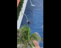 Man looking depressed in the pool in cancun