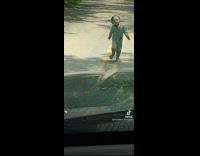 Collab VIBES - Kid in pajamas approaches filmer on the road