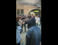 People form a mosh pit to live rock band 