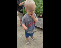 Baby eats chalk in backyard