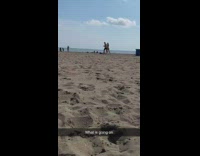 Guy girl stormtrooper costume mask run beach 