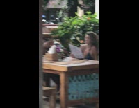 Guy photographs girl ordering food 