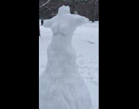 Snow sculpture of headless woman with butt 
