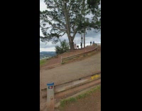 Women takes wedding photo on hiking trail 