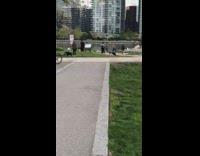 Men jump push up public park video shoot