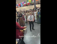 Guy dances to drum for culture day