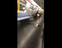 Guy lays on seat pees subway train