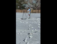 Woman remove sweater yellow bra snow tripod