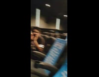 Group of guys say hooyah at movie theater