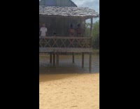 Two women bikini dances in the hut
