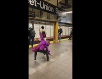 Woman dances with dog next to violinists 