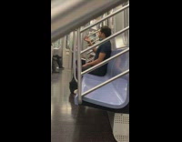 Black shirt guy smokes inside subway train